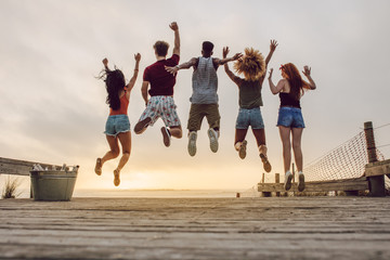 Group of friends enjoying at the beach