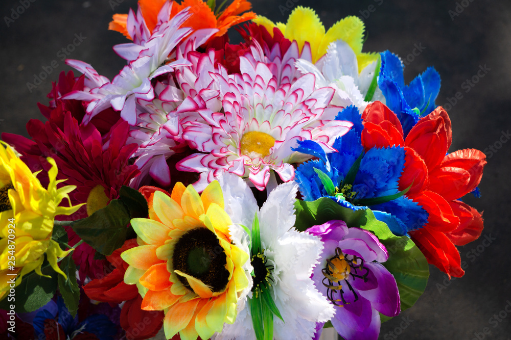 Obraz Tło kwiatu Partia sztucznych kwiatów w kolorowym składzie