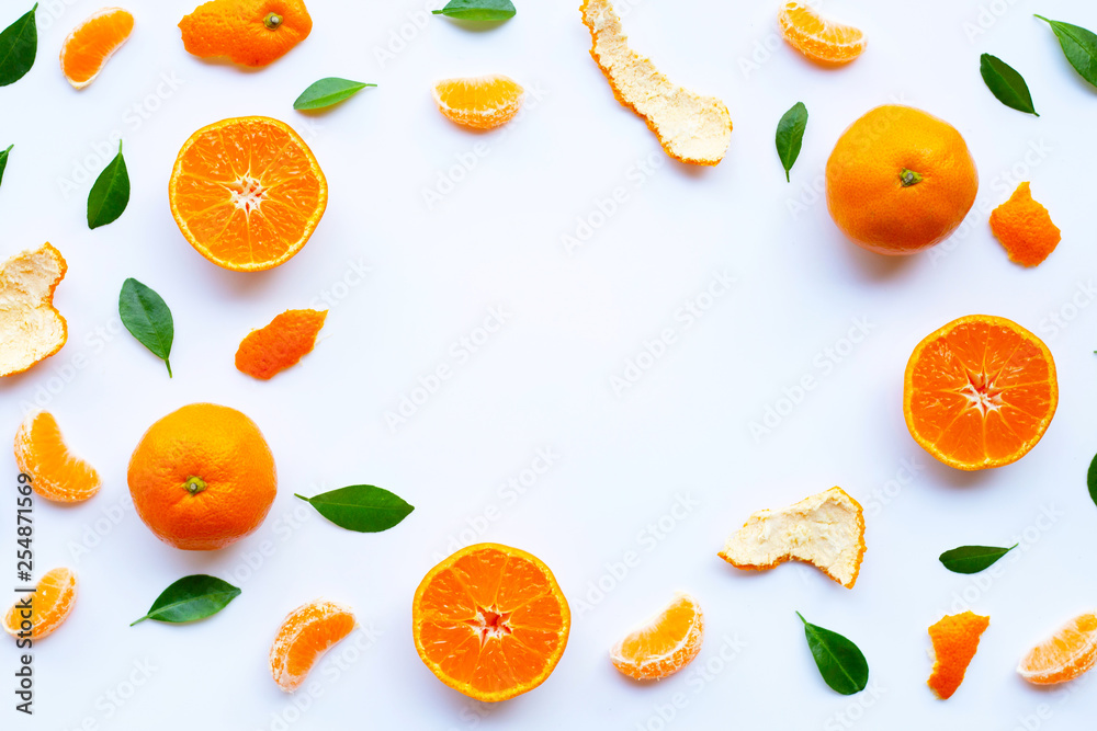 Fresh orange citrus fruit with green leaves on white. Fresh orange citrus fruit with green leaves on white.