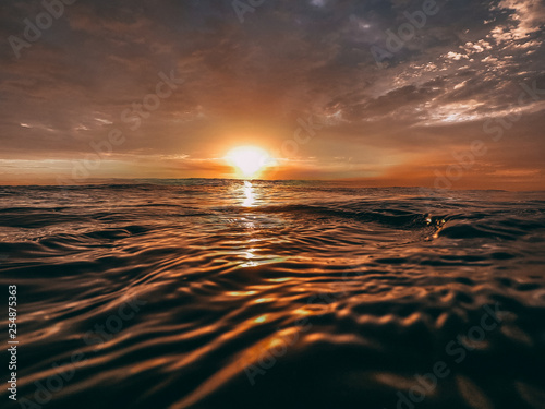 Orange sun over the ocean © Chris