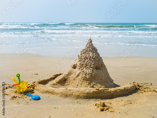 Sand castle by the sea close up