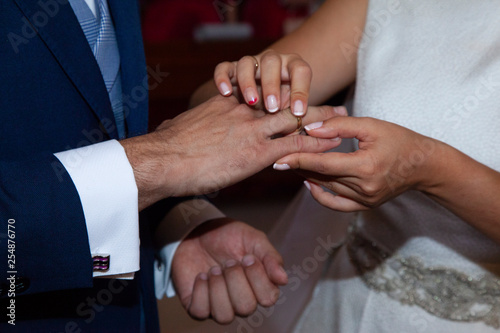 detail of the hands of the bride and groom