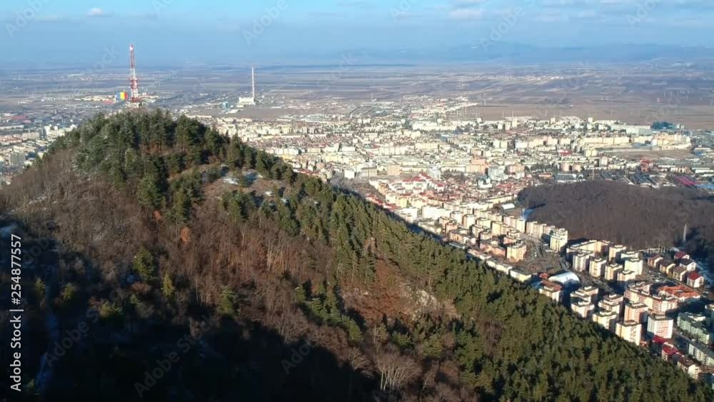 Rising over Tampa mountain, aerial view showing modern real estate developments in new districts of Brasov City, Romania Rising over Tampa mountain, aerial view showing modern real estate developments in new districts of Brasov City, Romania