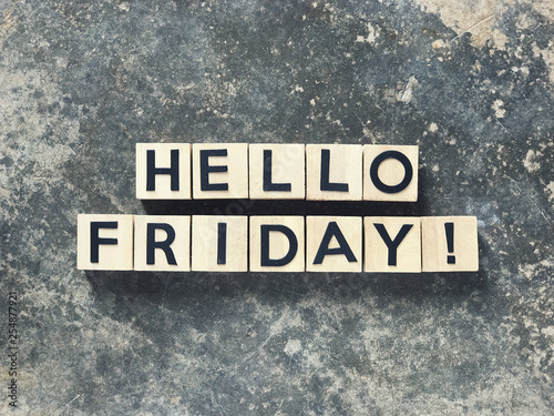 Motivational and inspirational quote - HELLO FRIDAY written on wooden blocks.