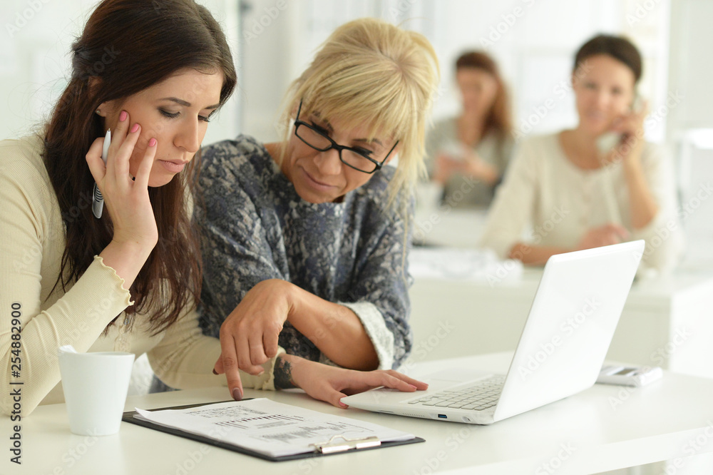 Portrait of women working together in office Portrait of women working together in office