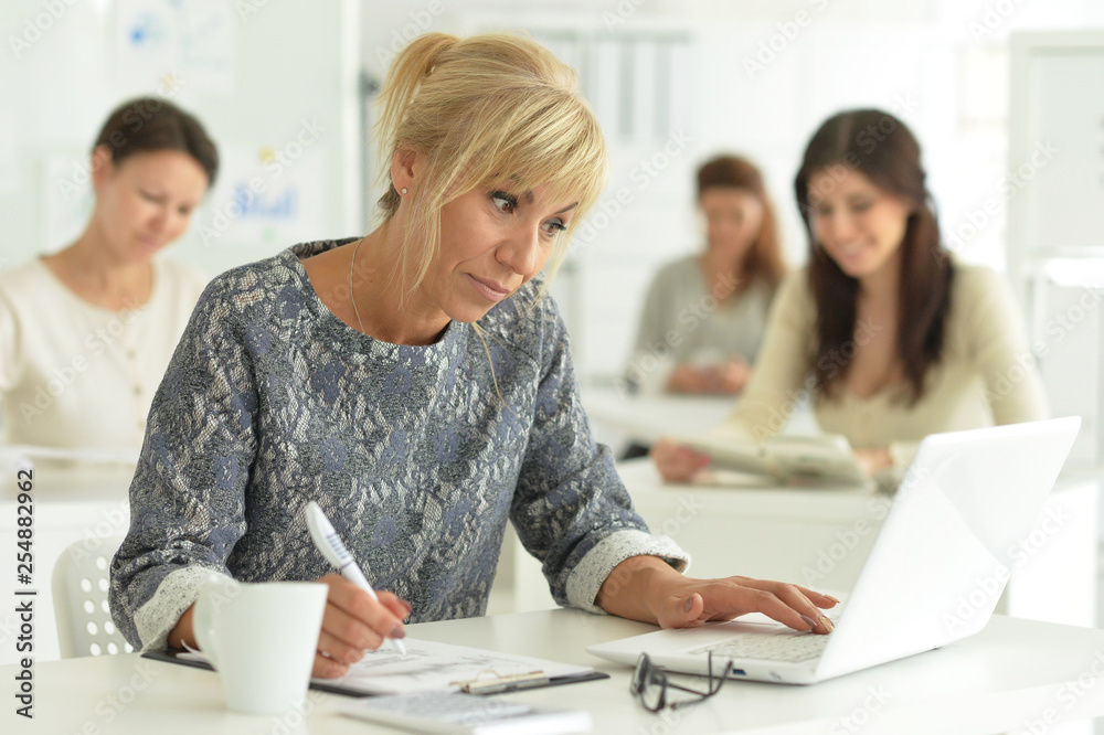 Portrait of women working together in office Portrait of women working together in office
