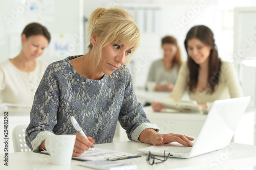 Portrait of women working together in office