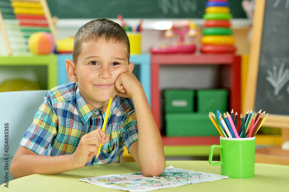 Portrait of little boy drawing with pencil Portrait of little boy drawing with pencil