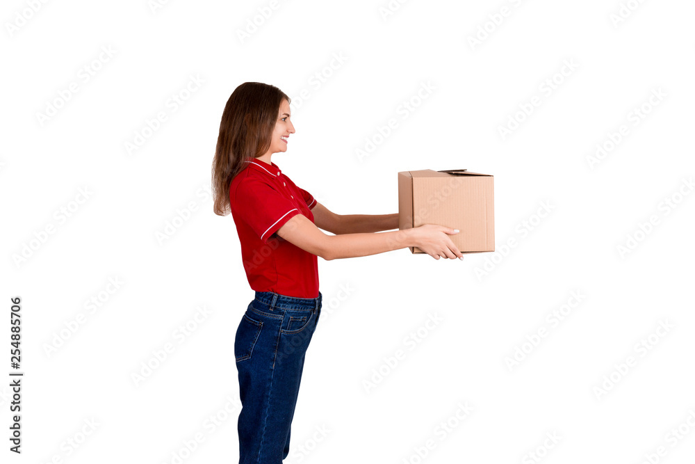 Pretty delivery girl is giving a cardboard box to a customer isolated on white background Pretty delivery girl is giving a cardboard box to a customer isolated on white background