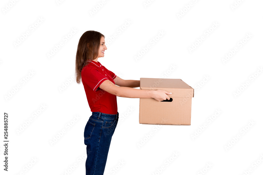 Pretty delivery girl is giving a cardboard box to a customer isolated on white background