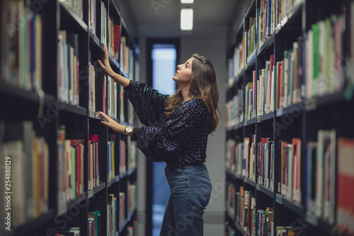 student have fun in a diktionary Library colorated in Berlin by #tigerraw
