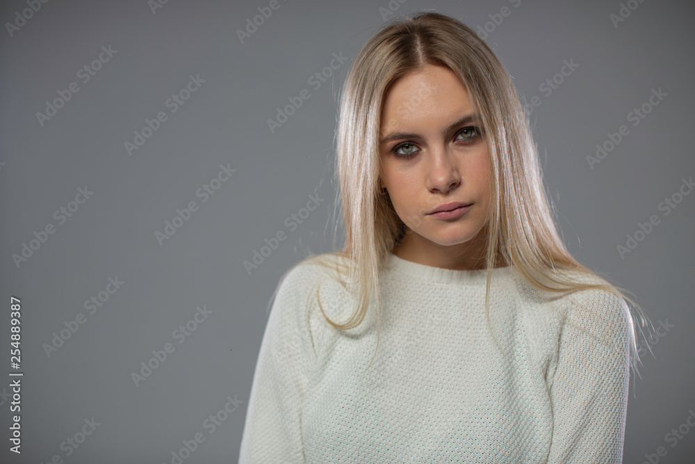 blonde looks into the camera