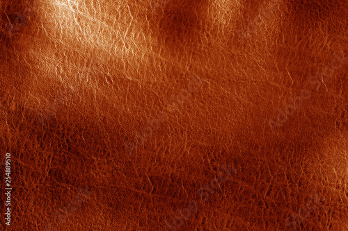 Orange toned leathered leather texture.