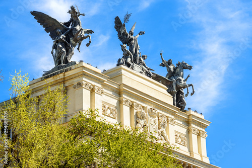 statues of a romantic style building of Madid photo