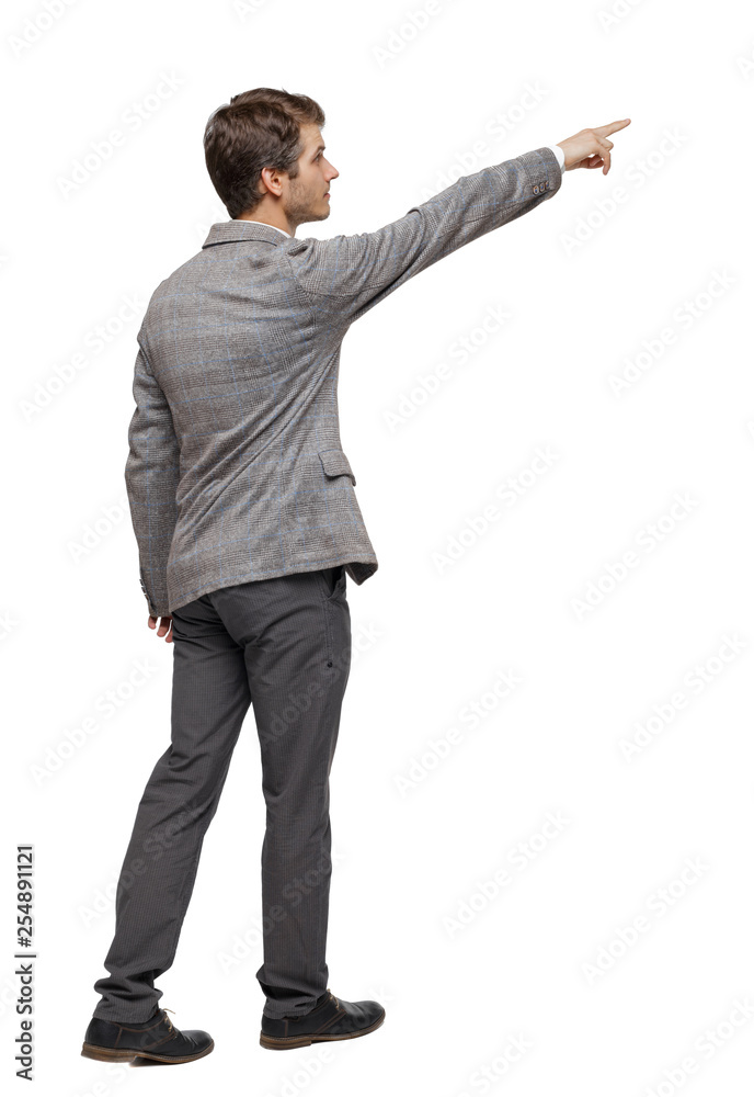 Back view of walking pointing business man. Back view of walking pointing business man.