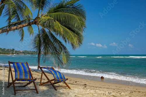 wooden deck chairs on tropical beach- Lamai  Koh Samui  Thailand