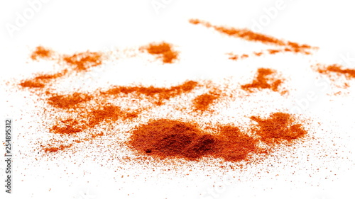 Red paprika powder pile isolated on white background