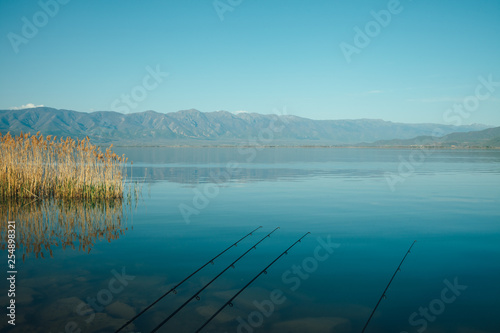 Fototapeta Naklejka Na Ścianę i Meble -  Fishing rods at lake
