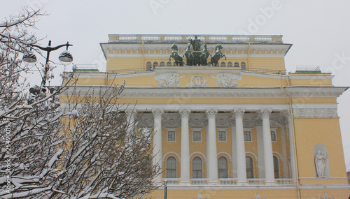 St. Petersburg winter scene with Alexandrinsky drama theatre building in Saint Petersburg, Russia. Seasonal outdoor wallpaper of famous city square and theatre with empty sky background photo