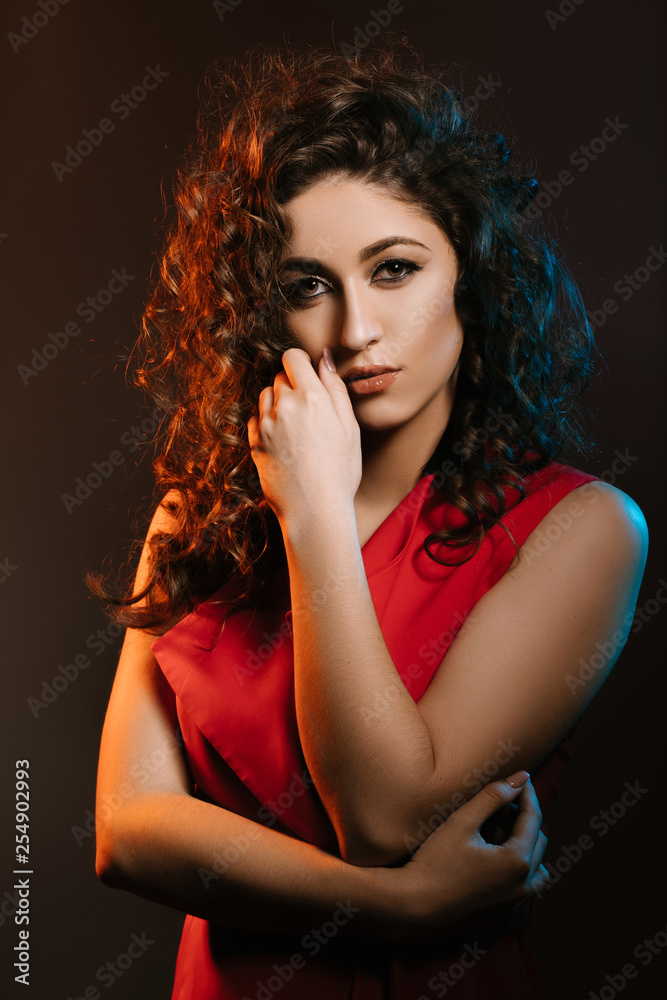 Attractive tanned woman . Oriental makeup, big arrows on the eyes, thick eyelashes. Attractive tanned woman . Oriental makeup, big arrows on the eyes, thick eyelashes.