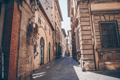 Fototapeta Naklejka Na Ścianę i Meble -  Old beautiful empty narrow streets in small city of Lucca in Italy