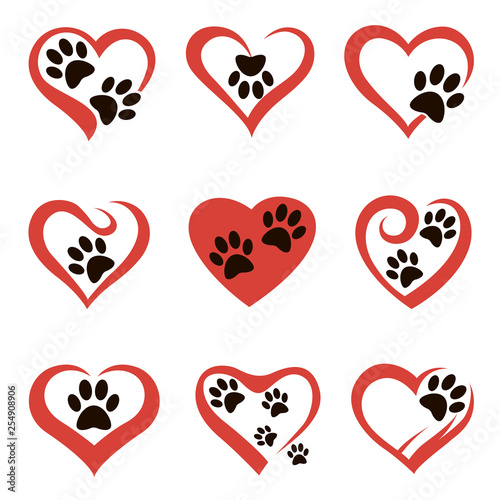 collection of dog or cat footprints in abstract red heart isolated on white background