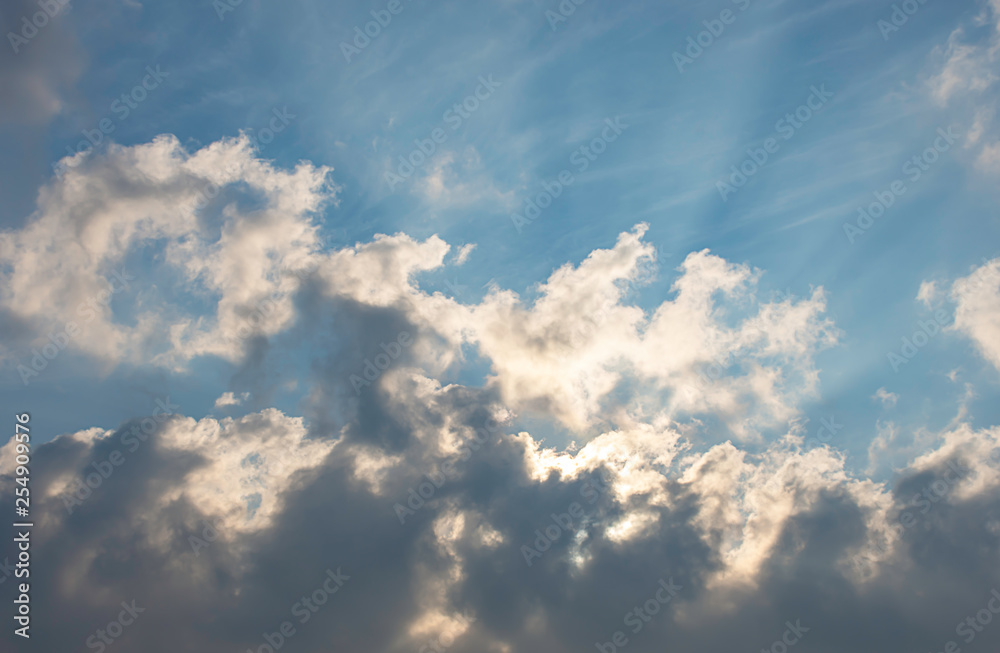 The beauty of the sky with clouds and the sun.