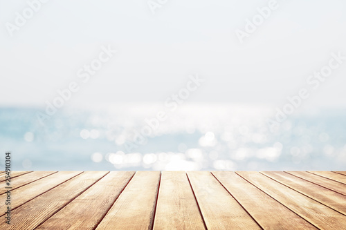 Blurred blue sky and sea with bokeh light