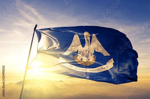 Obraz na płótnie Louisiana state of United States flag waving on the top sunrise mist fog