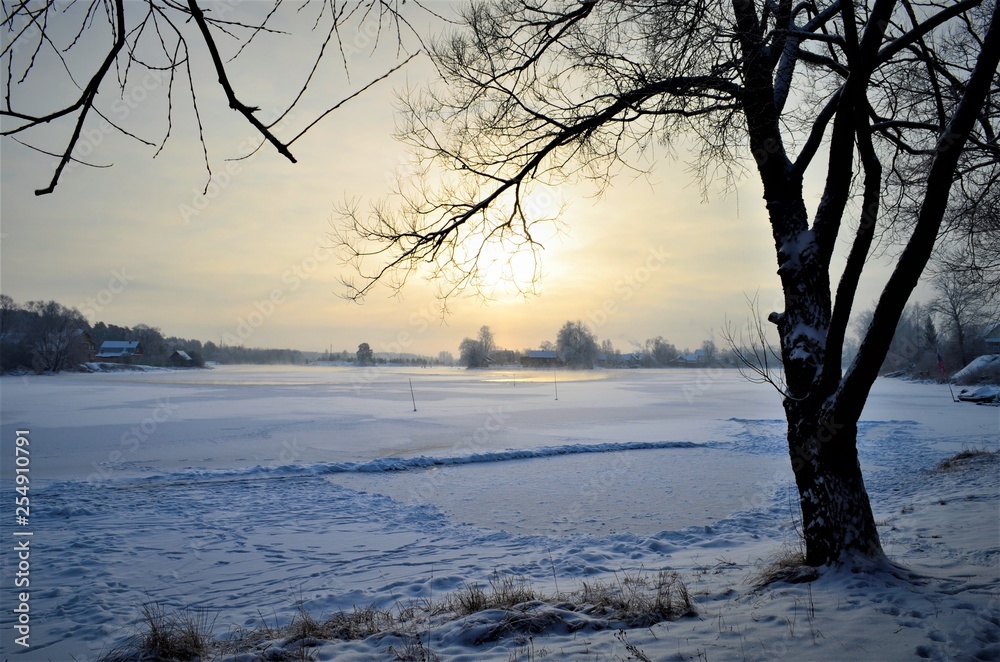 sunset over the river in winter sunset over the river in winter