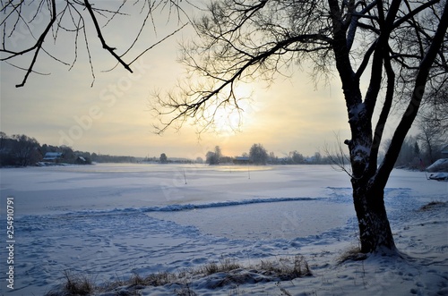 sunset over the river in winter