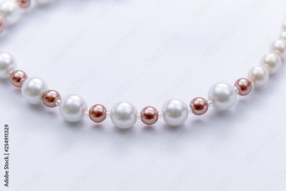 Closeup Pearl necklace on white background