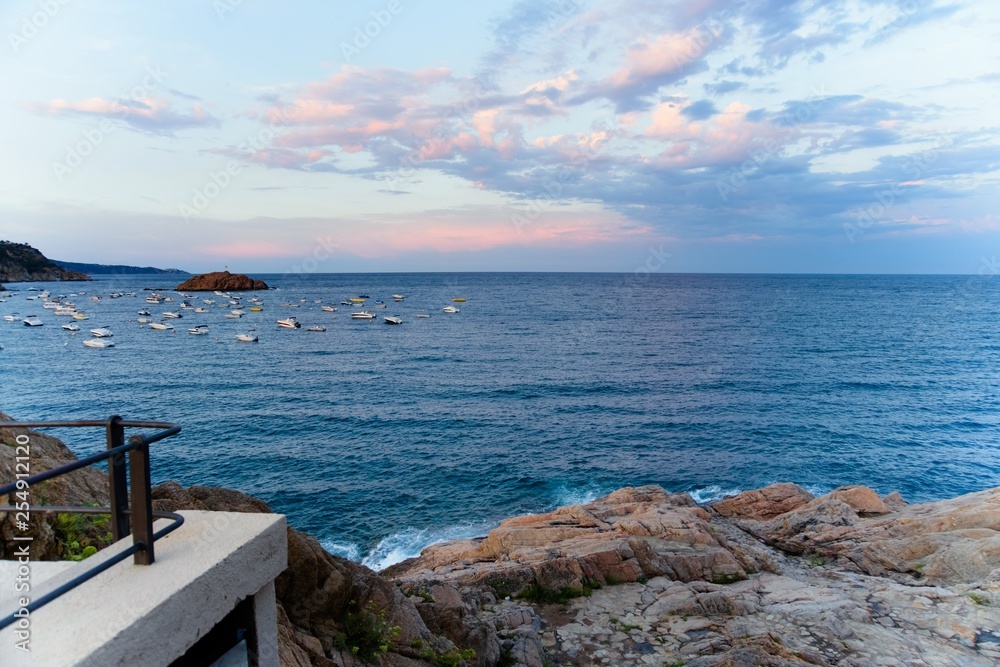 Tossa de Mar, Spain, August 2018. Magnificent sunset over the Mediterranean in Catalonia. Tossa de Mar, Spain, August 2018. Magnificent sunset over the Mediterranean in Catalonia.