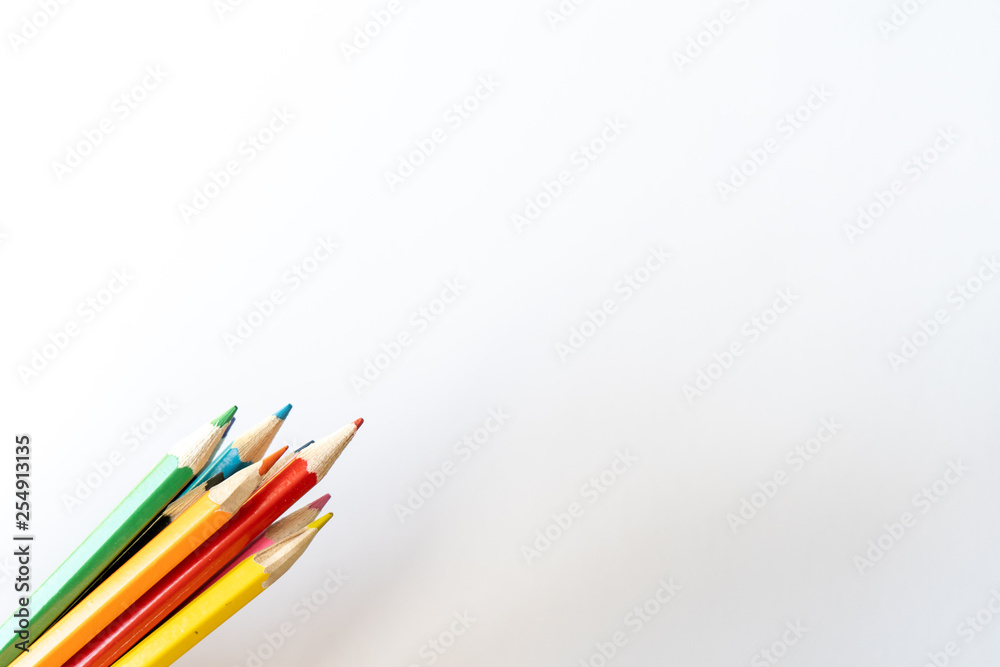 Fototapeta premium Bunch of colored pencils for child art on white background