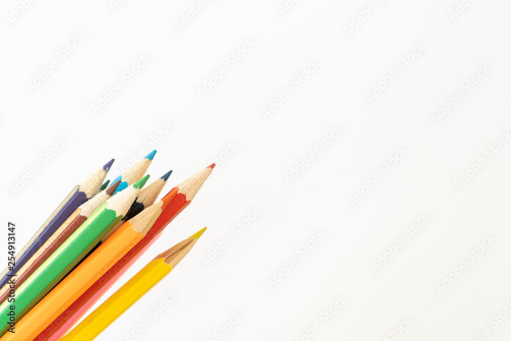 Colored pencils for child art on white background