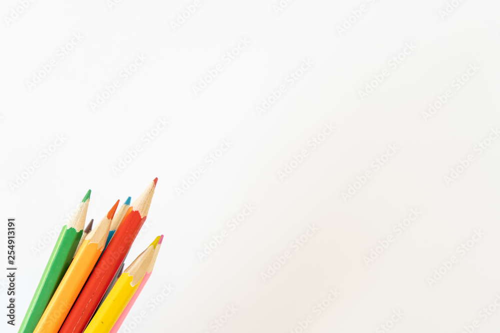 Fototapeta premium Bunch of colored children's pencils for drawing on a white background