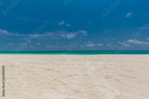 Empty beach scene with white sand and blue sea view. Sea sand sky concept