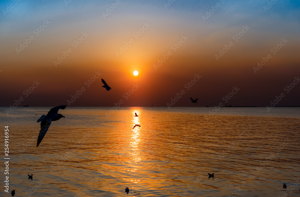 Landscape images, vivid bright colorful and beautiful of sunset and reflections on the sea water surface, to nature background concept.