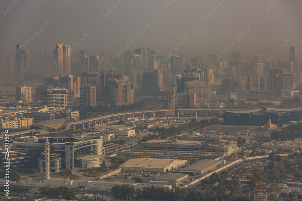 Fototapeta premium Dubai shrouded in a sandstorm as seen from the air