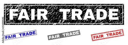 Grunge FAIR TRADE rectangle stamp seals isolated on a white background. Rectangular seals with grunge texture in red, blue, black and gray colors.