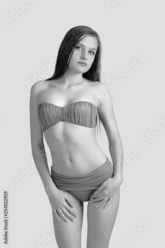 Slim body of young woman in bikini on white . Girl with healthy sporty figure © zhagunov_a