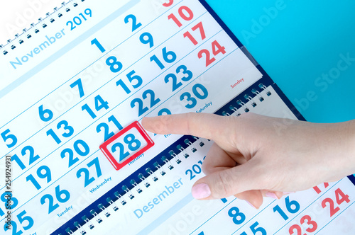 hand points to holidays in the calendar 28 november