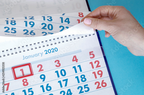 hand points to holidays in the calendar 1 January