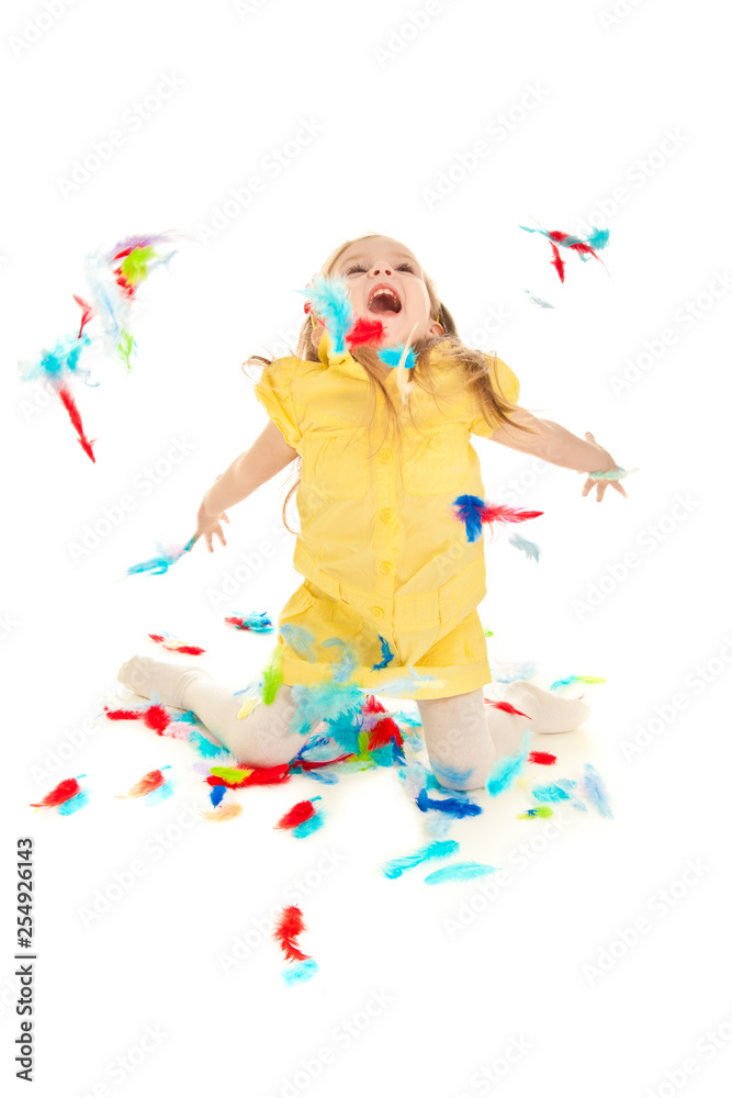 Little girl with feathers laughing