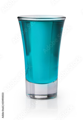 Blue shooter in a shot glass on white background