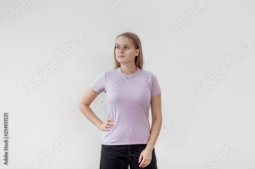 Girl in purple t-shirt on white background