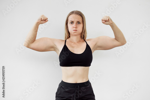 Girl shows big biceps