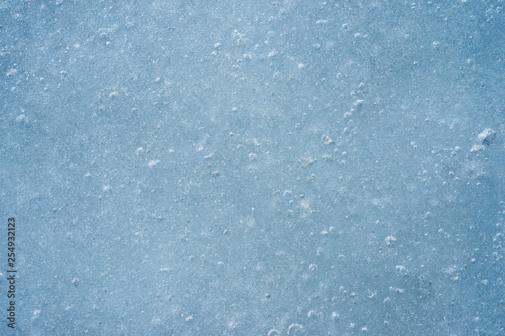 Ice with air bubbles of a blue shade. Textured abstract natural background Ice with air bubbles of a blue shade. Textured abstract natural background