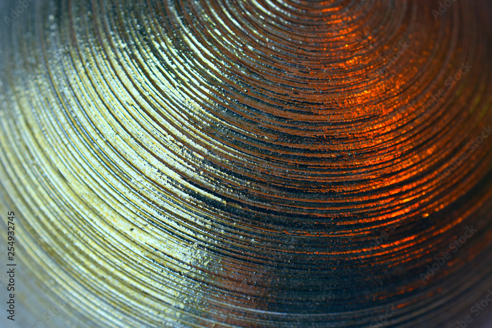 Obraz premium metal surface with concentric circular grooves glare with highlights fragment