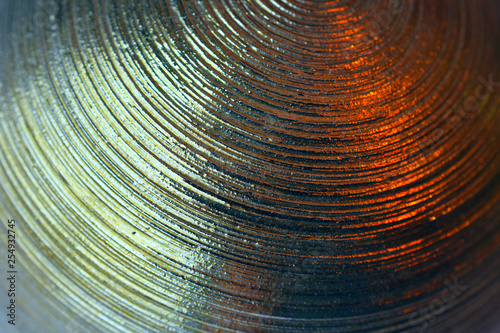 Wall Mural metal surface with concentric circular grooves glare with highlights fragment